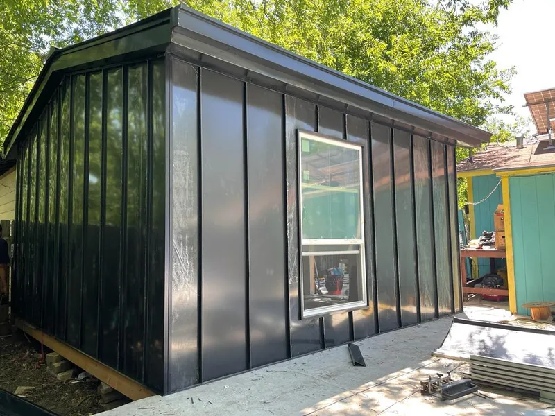 Black standing seam metal wall panels for Metal Roof Installation in Hartland