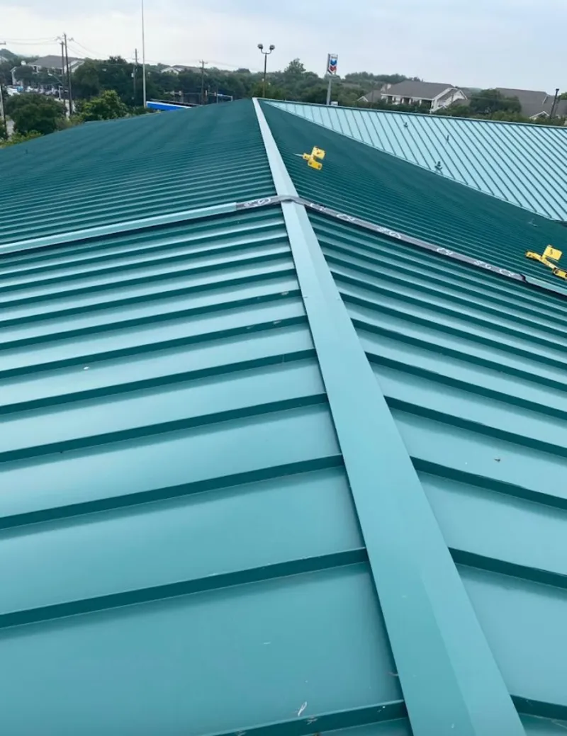 Green commercial metal roof ridge and valley for Metal Roof Repair in Hartland